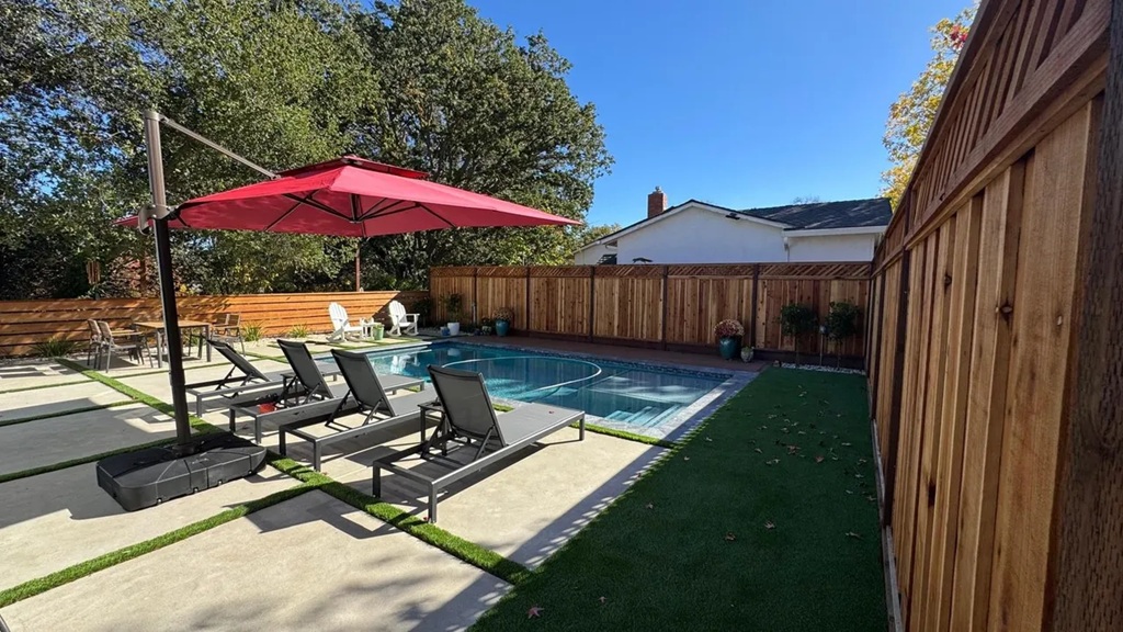 Backyard hardscape with pool, concrete pavers, turf and cedar fence — East Bay hardscape project